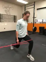 split squat with resistance band around knee
