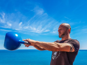 man holding a kettlebell